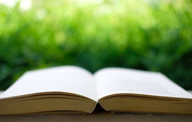 open book on wooden table