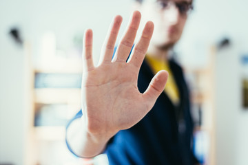 Defense or stop gesture: Male hand with stop gesture