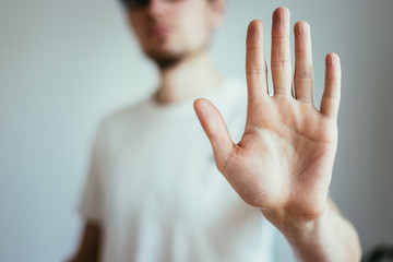 Defense or stop gesture: Male hand with stop gesture