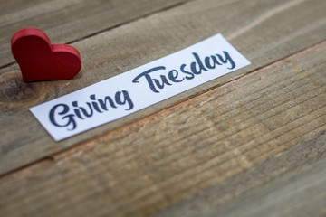 Giving Tuesday donate charity concept with text on wooden board