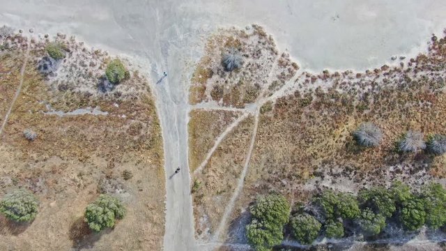 Aerial high angle drone view footage of Loch Iel, also called Pink Lake, near the village of Dimboola in Victoria, Australia. The pink color results from red pigment secreted by microalgae in summer.