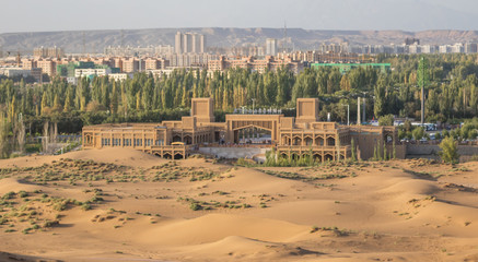 Fototapeta premium Shanshan, China - located right ad the border of the Kumtag Desert, Shanshan is a medium sized city often used as starting point for the desert excursions