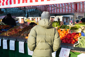 Man shopping for fruit and vegetables at market 
