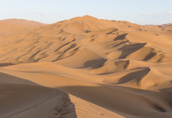 Fototapeta na wymiar Kumtag Desert, China - a section of the wider Taklamakan Desert, and part of the Tarim Basin, the Kumtag Desert is famous for it's sandy dunes and the beauty of its landscape