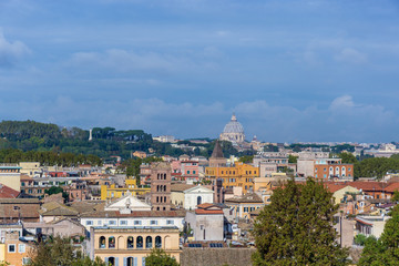 view of Rome from Orange Garden with the Vatican dome of Saint Peter Basilica in the background, Aventine Hill. Rome, Italy
