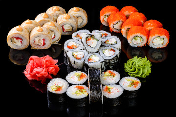 sushi set on a black mirror background