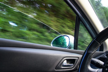 Driving with speed mirror while driving outdoor