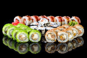 sushi set on a black mirror background