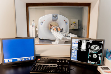 Patient in the room of computed tomography at hospital.