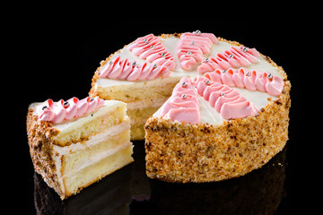 Dessert stand with delicious chocolate cake on black background