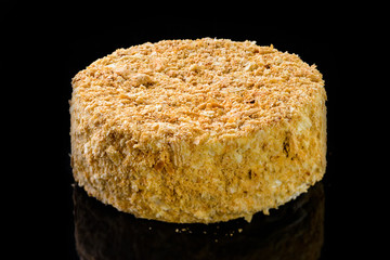 Home cake Napoleon on a black table. Free space for text.