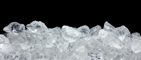 heap of ice crystals on black background