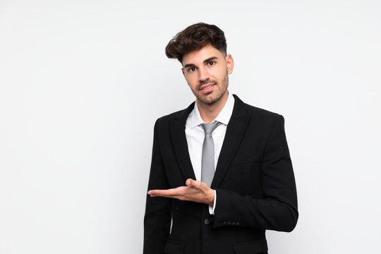 Young businessman over isolated white background extending hands to the side for inviting to come
