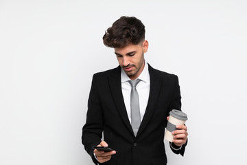 Young businessman holding coffee to take away over isolated white background