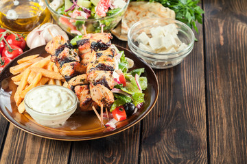 Chicken Souvlaki with french fries and tzatziki sauce