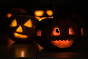 Group of the halloween, tasty pumpkins in the darkness during cold october night in Poland, Wroclaw
