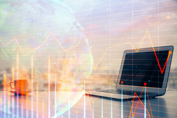 Stock market graph on background with desk and personal computer. Multi exposure. Concept of financial analysis.