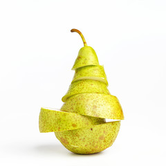 Appetizing ripe Pear cut into several parts on a white background. Creative concept