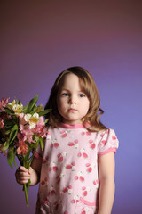a beautiful little girl with flowers
