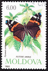 Fototapeta na wymiar GROOTEBROEK ,THE NETHERLANDS - MARCH 15,2016 : A stamp printed in Moldovia shows image of butterfly ,1993.