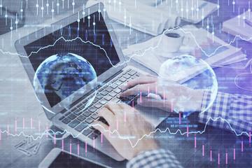 Double exposure of forex chart with man working on computer on background. Concept of market analysis.