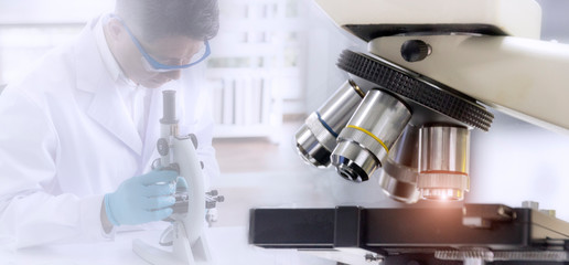 Laboratory concept; Close up  picture of microscope with blurred background of researcher use microscope in laboratory