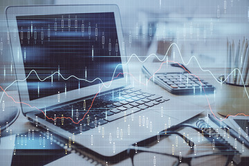 Stock market graph and table with computer background. Multi exposure. Concept of financial analysis.