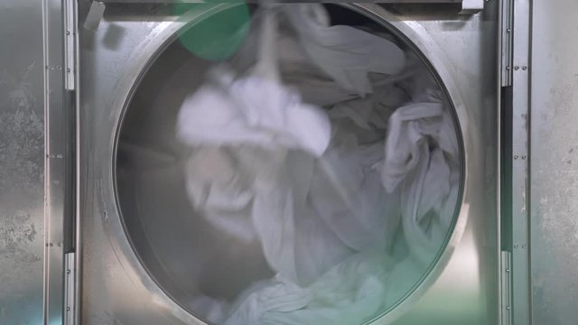 4k Video of industrial drying machine is drying a big amount of textiles