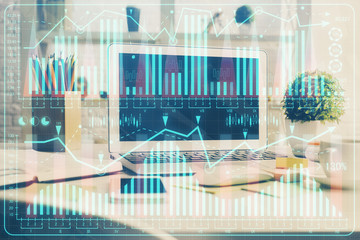 Financial graph colorful drawing and table with computer on background. Double exposure. Concept of international markets.