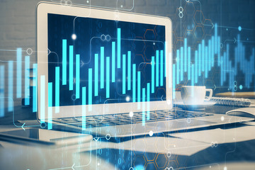 Forex market graph hologram and personal computer on background. Multi exposure. Concept of investment.