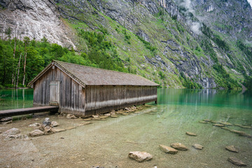 Fototapeta na wymiar Boathouse on the Koenigsee lake in Bavaria Alps. Germany.