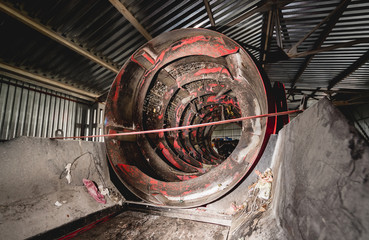 At modern recycling plant. Conveyor belt for transports garbage inside a drum filter.