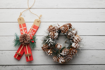 Christmas outdoor background with fir tree branches, decorations and blurred lights on back