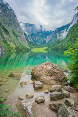 View of the upper Obersee lake, near Koenigsee. Bavaria. In the background the highest waterfall of Germany - Rothbachfall.