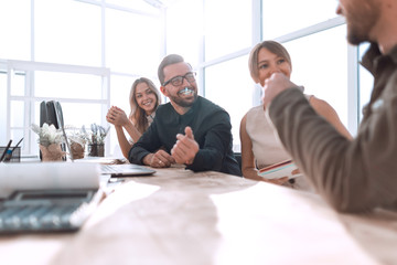 Fototapeta premium business team discussing documents sitting at the table