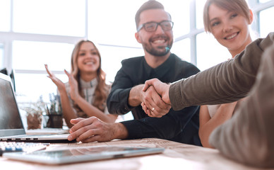 handshake business people at a meeting in the office