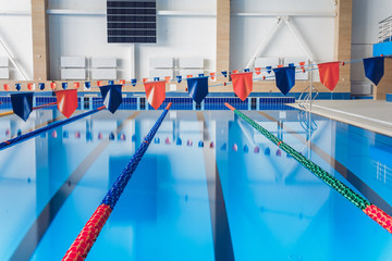 Naklejka premium Swimming pool without people. Sunny day at the pool