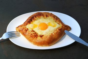 Plate of Mouthwatering Adjarian Khachapuri, Popular Traditional Georgian Bread 