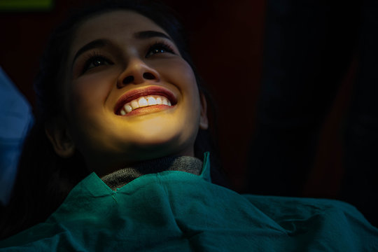 Dentist examining mouth teeth of beautiful young Asian woman in hospital clinic dental health care beautify oral hygiene concept