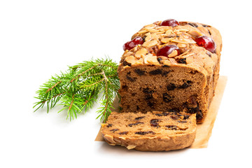 Mixed fruit loaf cake with almond flakes isolated on white