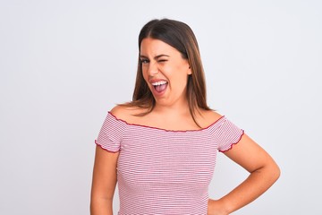 Fototapeta premium Portrait of beautiful young woman standing over isolated white background winking looking at the camera with sexy expression, cheerful and happy face.