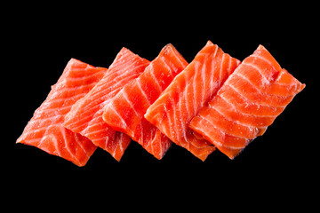 Sashimi Japanese food, slices of salmon on a black table. Fish slices
