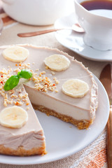 Banana cheesecake without baking on a wooden table, selective focus