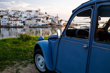 Old 2CV in front of an old city