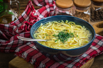 Broth - chicken soup in a bowl.