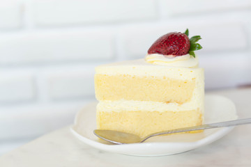 Closeup Milk cake delicious on glass table background, selective focus