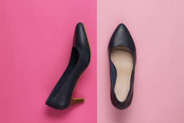 Classic women's high heel shoes on color paper background. Stylish shoes. Minimalistic fashion still life.