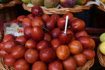 Closeup of tomatoe passion fruits on a local market in Funchal in Madeira, Portugal