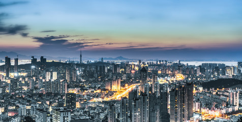 Night view of Qingdao coastline architecture and urban skyline..