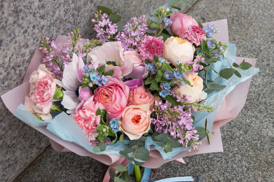 Beautiful rich designer wedding pink blue bouquet with roses and lilac flowers